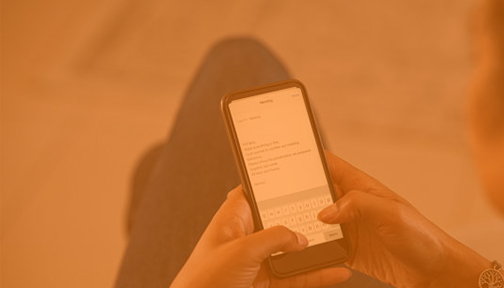 Person sending an email on a smartphone